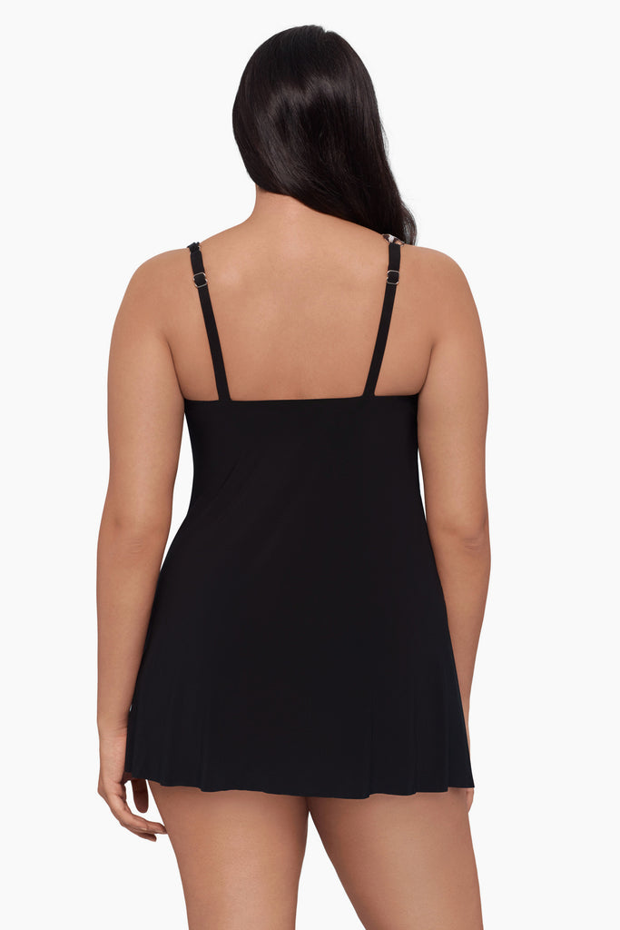 Woman faced away wearing a swim dress 